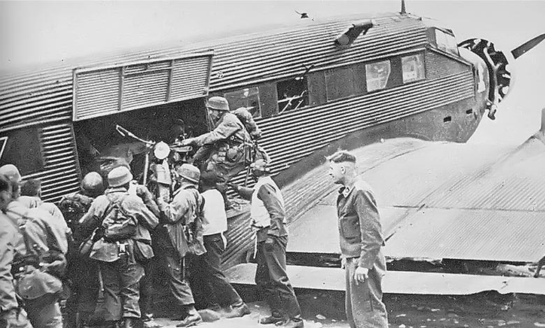 German Fallschirmjägers unloading a Kettenkrad from a Luftwaffe Junkers Ju 52 transport plane