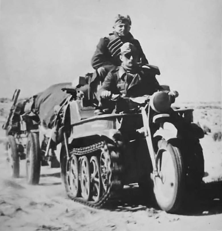 German Afrika Korps soldier driving a Kettenkrad in the desert, 1942