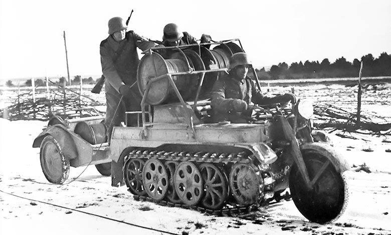 German signalmen are laying a cable with Sd.Kfz. 2 Kettenkrad