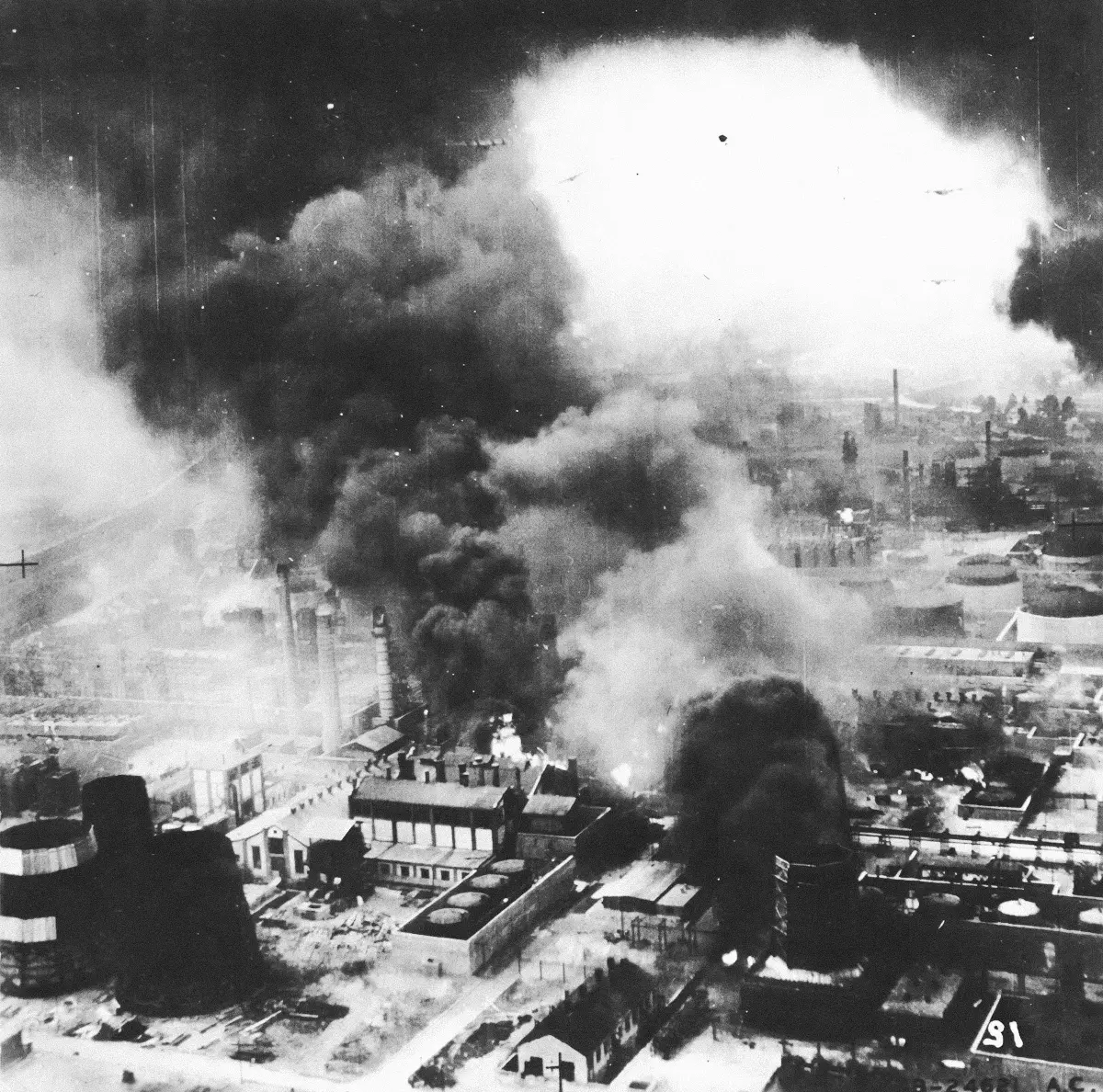 Smoke rises from the Astra Romana refinery in Ploesti, following a low-level bombing attack by B-24 Liberators, on Aug 1, 1943